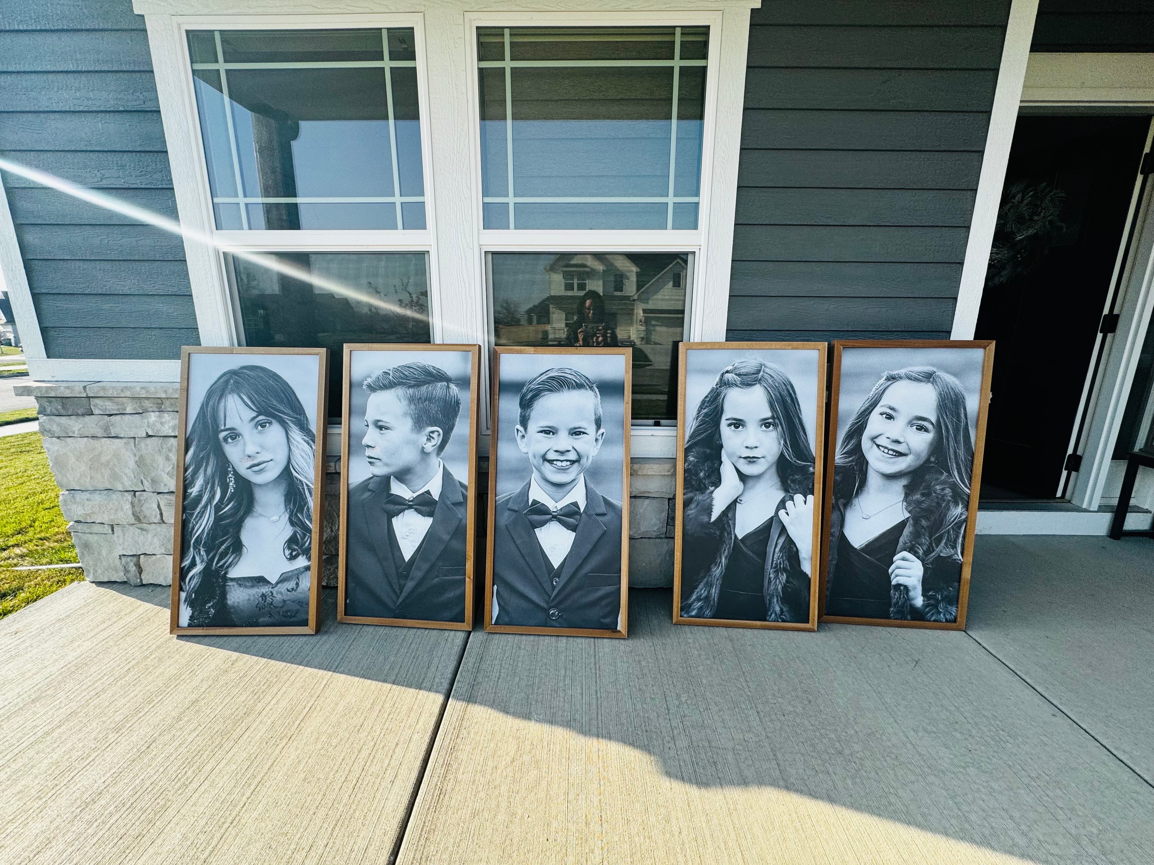 Empty child portraits on Meg's porch after her five children were removed
